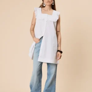 Woman wearing TBCo Cotton Broderie Sleeveless Dress in White made with natural and recycled fibres, women-founded, designed to make an impact