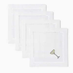Henry Handwork white linen cocktail napkins with hemstitch border and embroidered coupe glass.